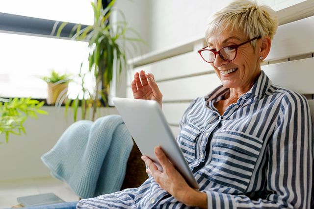 Stylish woman using tablet computer