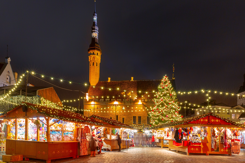 Festive Christmas market with lights and stalls at Town Hall Square in Tallinn, Estonia