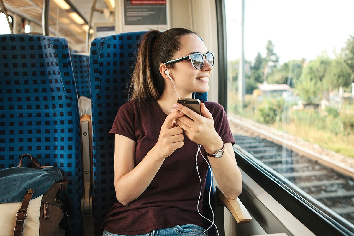 Listening to podcast on train