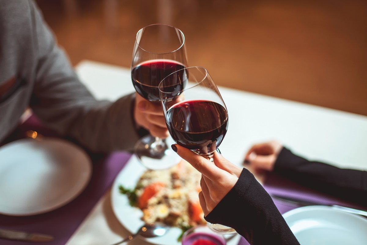 Couple toasting with wine glasses