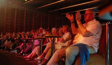 Audience seated in the Palladium theater on Ambition applauding