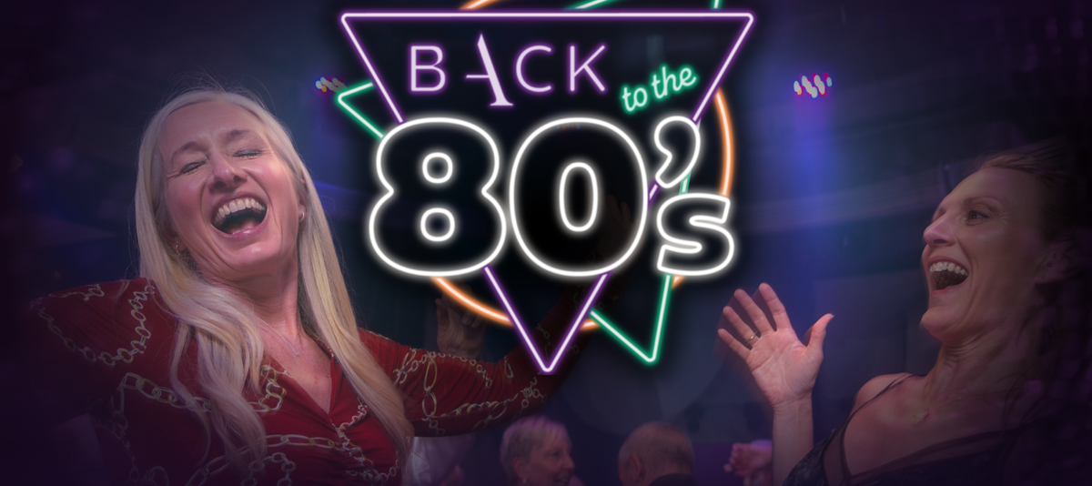 Two people joyfully dancing with a neon "Back to the 80's" sign in the background, featuring vibrant geometric shapes.