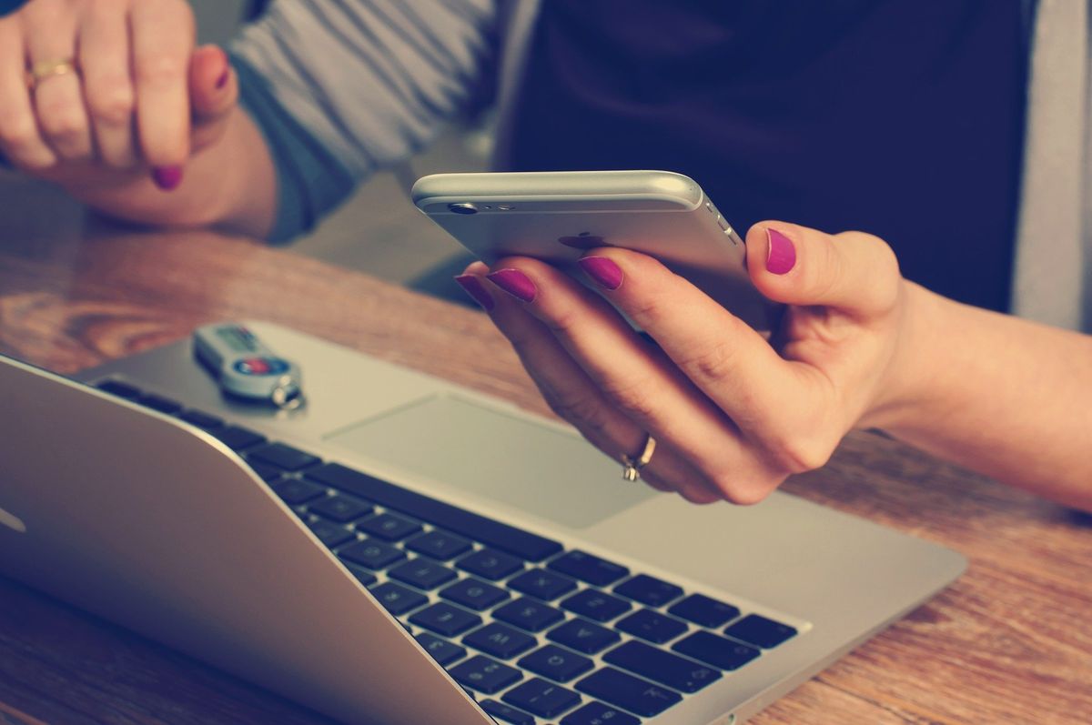 Woman on a laptop and mobile