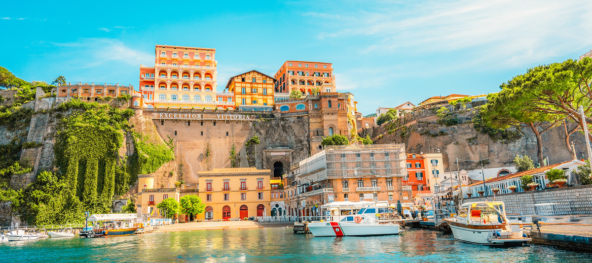 Streets in a touristic town, Sorrento near Amalfi coast, Italy. with a view of Naples and the Vesuvius volcano in the background