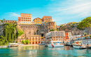 Streets in a touristic town, Sorrento near Amalfi coast, Italy. with a view of Naples and the Vesuvius volcano in the background