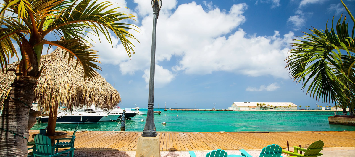 Idyllic tropical waterfront in Oranjestad in Caribbean Aruba island with view of turquoise ocean water