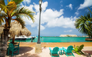 Idyllic tropical waterfront in Oranjestad in Caribbean Aruba island with view of turquoise ocean water