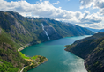 A landscape of the Langfoss waterfall and mountains in Akrafjorden, Norway
