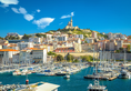 City of Marseille harbor and Notre Dame de la Garde church on the hill view, southern France