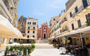 Corfu town picturesque street with cafe and flowers, Corfu island, Greece