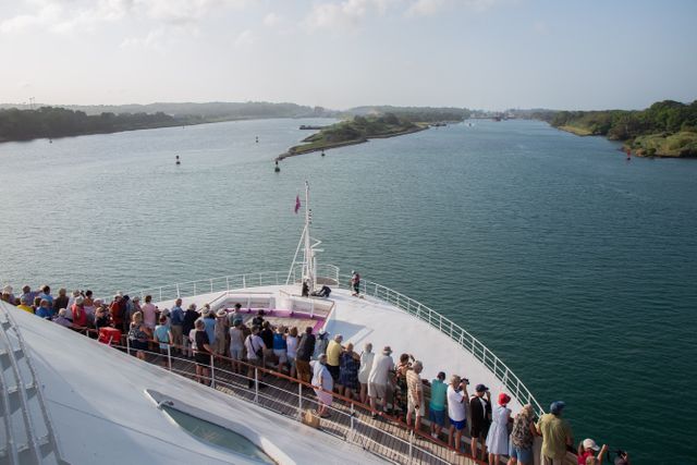 Guests on Ambience cruise ship watching the arrival at the Panama Canal on a World Cruise