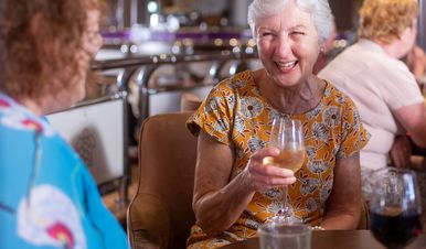 Woman enjoying a glass of wine.