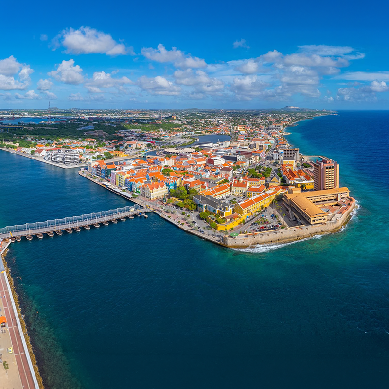 Willemstad historic city center aerial view including Otrobanda on the left and Punda on the right in city of Willemstad, Curacao.